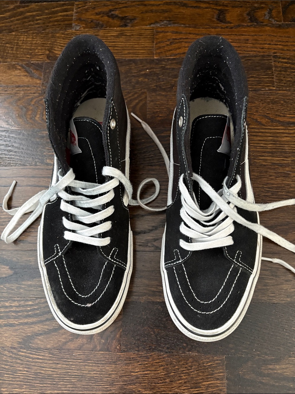 Vans Black and White High-Top Skate Shoe with Red Liner